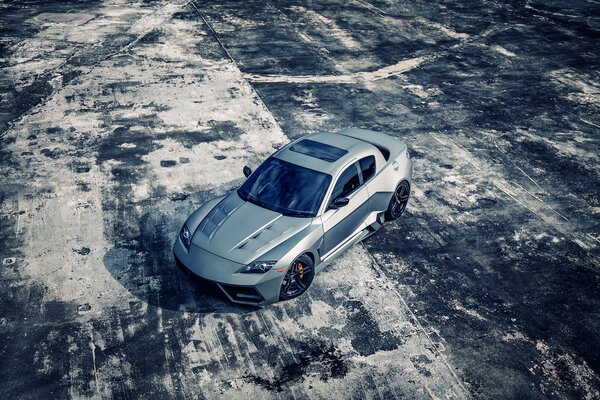 Mazda rx8 sports on a snow-covered playground