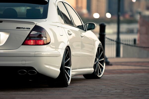 White AMG on paving slabs