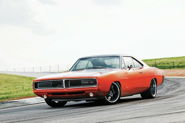 Red dodge charger on the race track