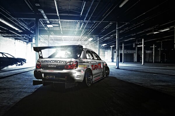 Tuned sports Subaru in the hangar