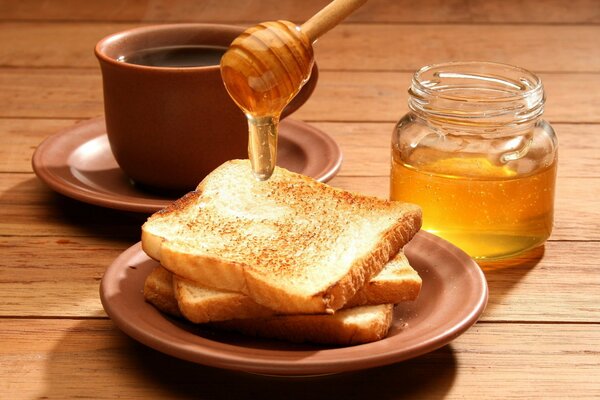 Delicious toast with honey and tea