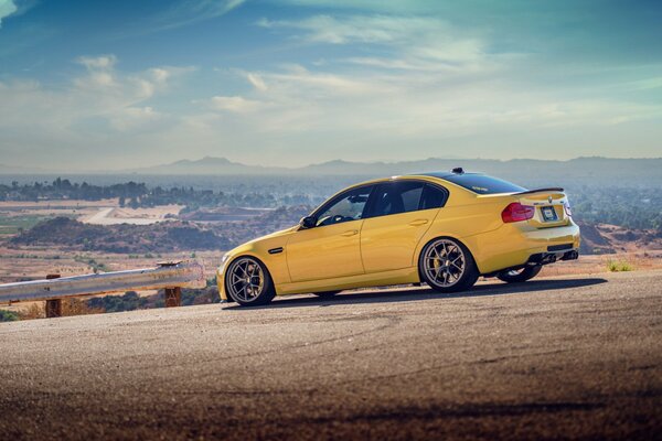 Yellow bmw m3 car on the road