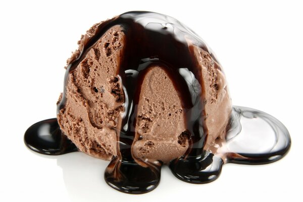 A ball of chocolate ice cream with syrup