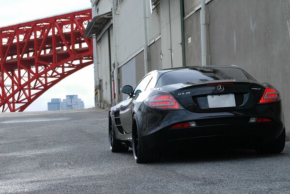 Black Mercedes Benz on the asphalt. Rear view