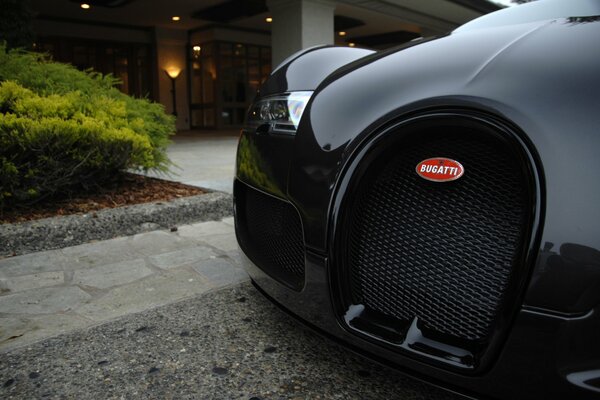 Bugatti of exotic black color on the street