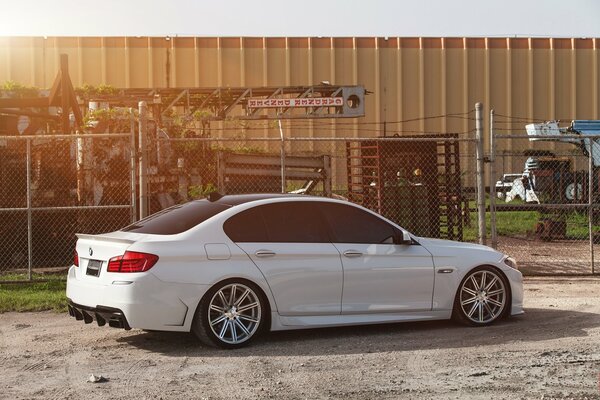 White BMW near the fence