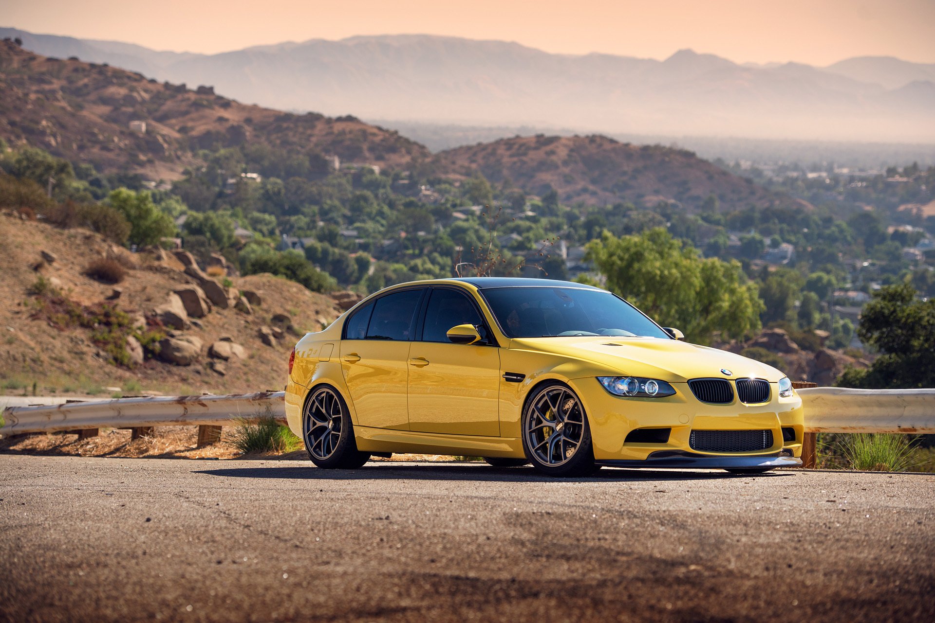 bmw m3 e90 yellow front bmw fence bump hills horizon