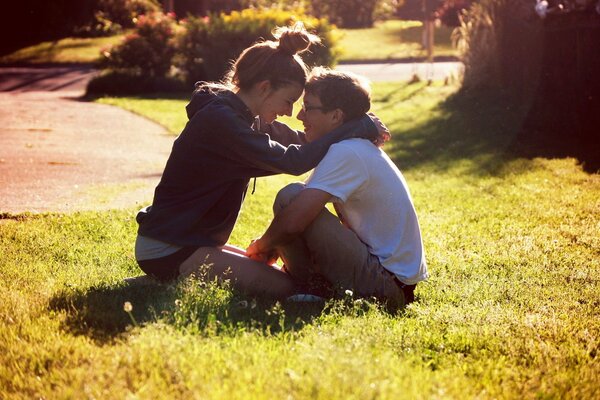 A date on the lawn in a park outside the city