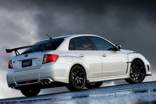 White tuned Subaru Impreza with tinted windows