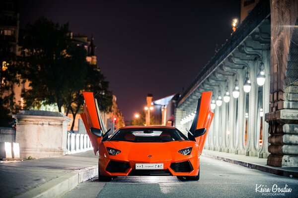 Lamborghini with open doors in Paris at night