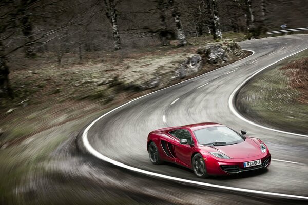 The sports car turns on the road at speed