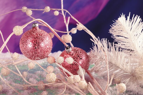 Pink Christmas tree balls and white fir branches