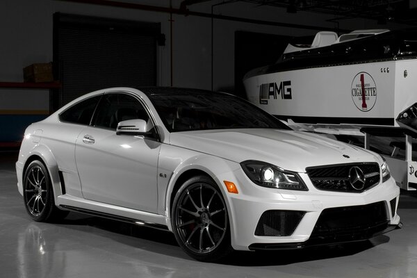 White Mercedes in the garage for tuning