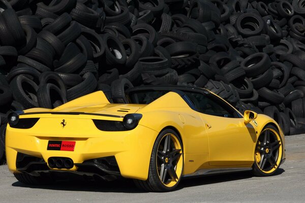 Yellow Ferrari 458 Italy on the background of tires