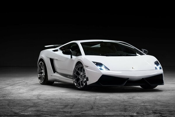 White Lamborghini Sports Car Front View at Night