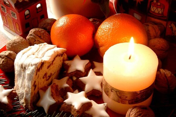 Christmas cake, oranges and candles