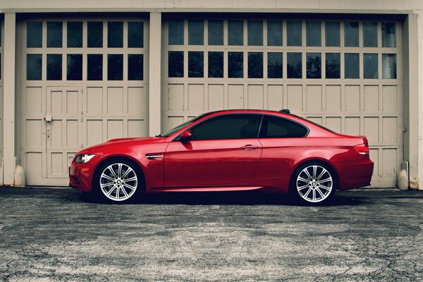 Red bmw m3 at the garage