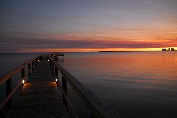 Romantic evening on the pier at sunset