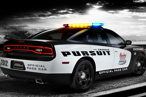 Police car Charger pursuit rides on black and white background