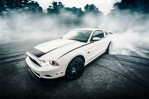 Drift Ford Mustang at full speed in the woods