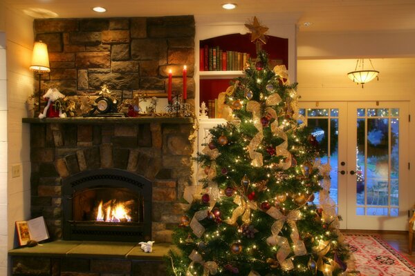 Christmas tree by the fireplace in a cozy room