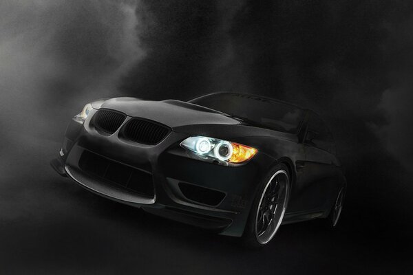 Black BMW lights up in the dark