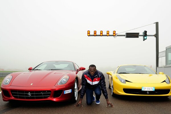 Sportler im Hintergrund von zwei Autos
