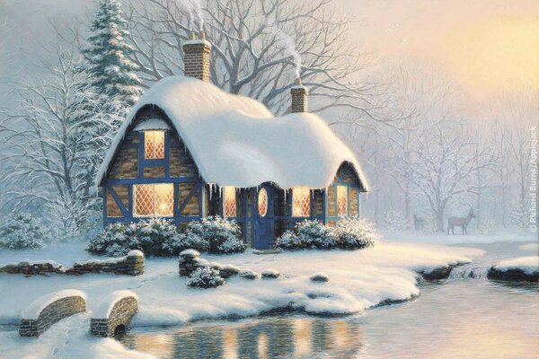 A house in the snow on the river bank