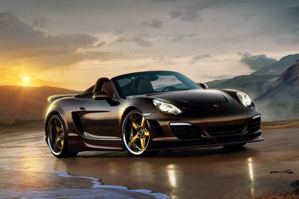 Black Porsche by the sea