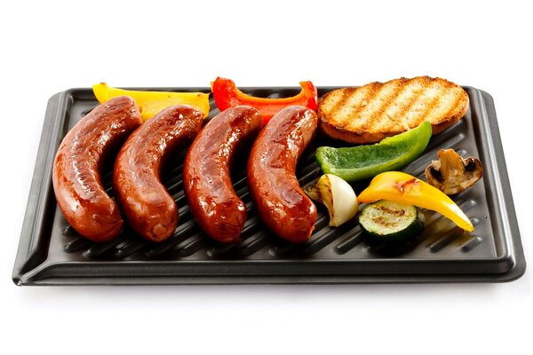 Grilled sausages on a baking sheet