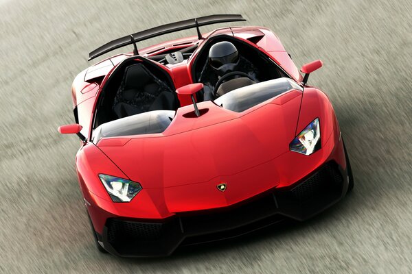 Красная машина Lamborghini едет. Водитель в шлеме