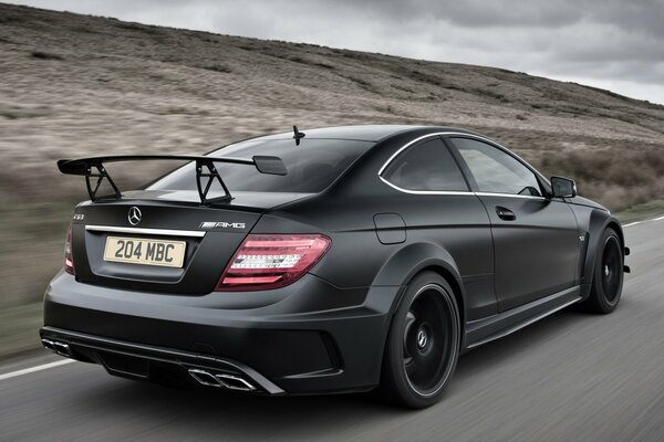 Black Racing Mercedes on the road