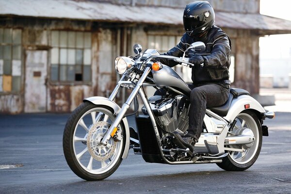 Biker wearing a helmet on a honda motorcycle