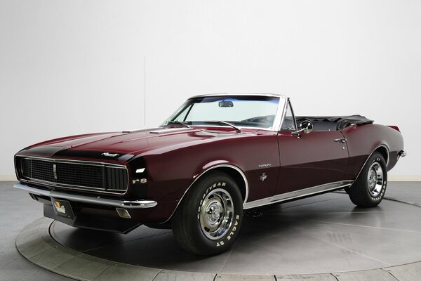 Burgundy Chevrolet convertible at the exhibition