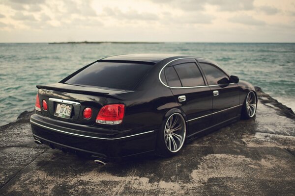 Black car on the seashore
