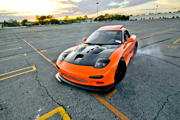 Orange sports mazda drifts