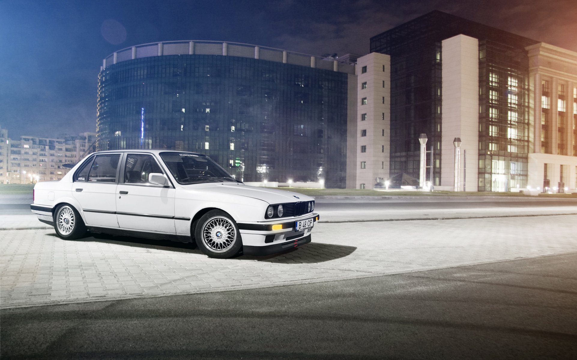 bmw 3 series e30 sedan white bmw night street building