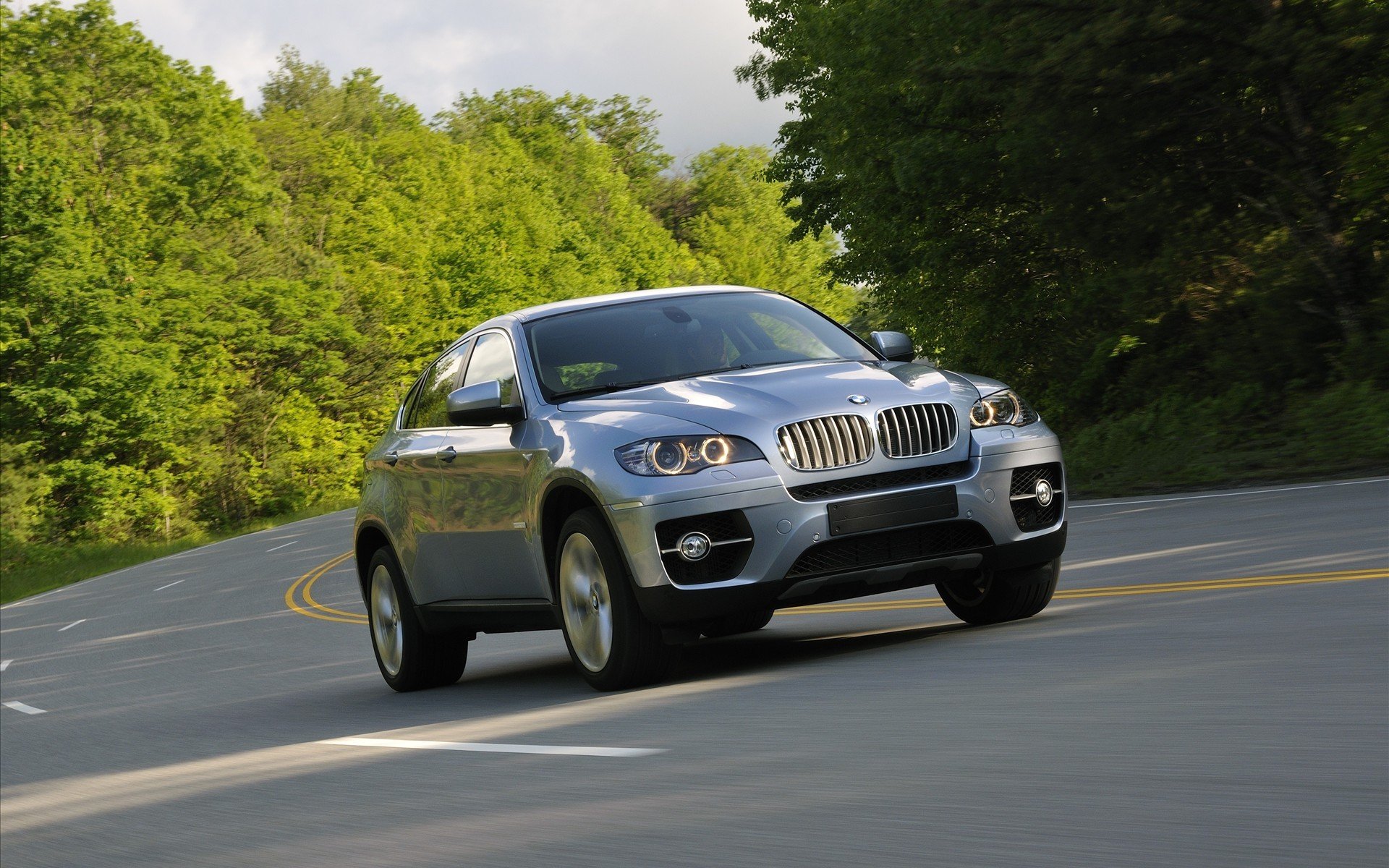 bmw x6 bmw ix6 jeep front road tree