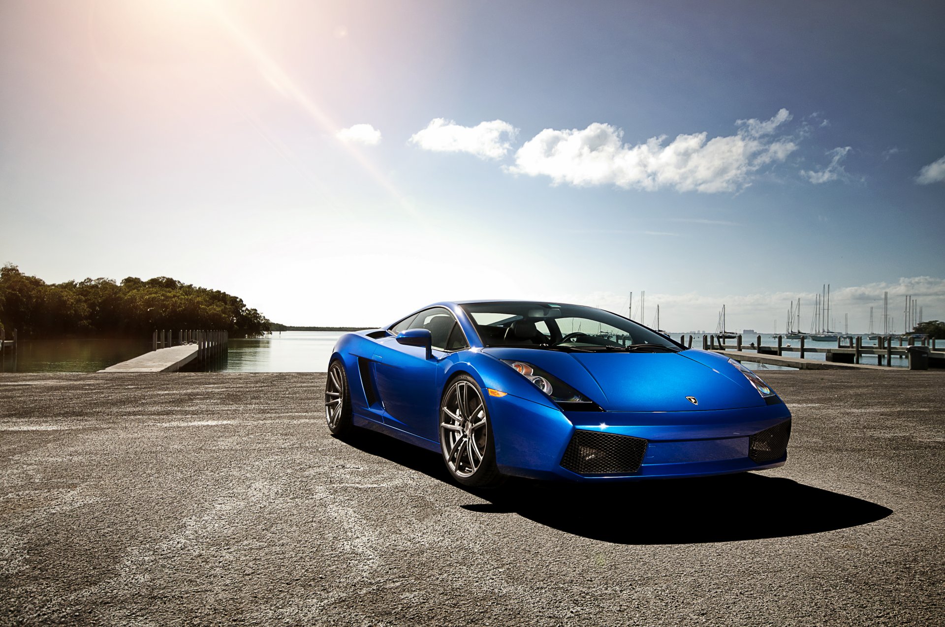 lamborghini gallardo azul lamborghini lamborghini gallardo frente cielo nubes resplandor muelle yates