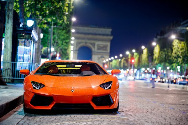 Lamborghini aventador on the background of Paris at night
