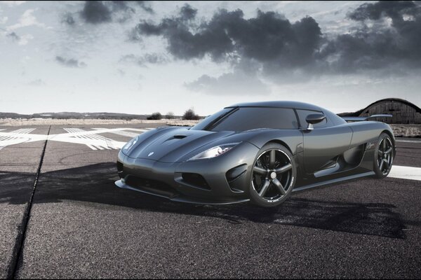 Koenigsegg agera of dark gray color stands on the road