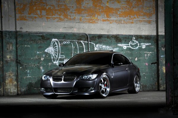 Black bmw 335i on a wall background