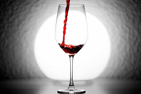 A glass filled with red wine
