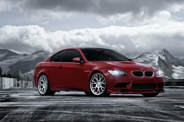 Red BMW car in the mountains