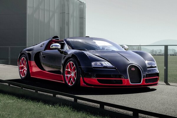 Bugatti hypercar is black and blue. Sports car