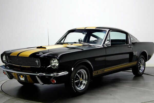 Classic cars. Black mustang with yellow stripe