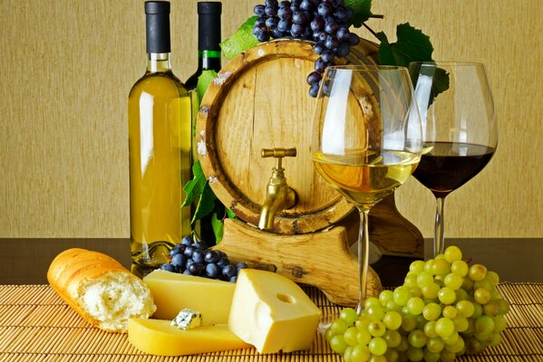 A barrel of wine with grapes and cheese