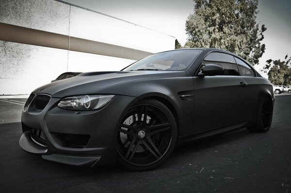 Sporty black matte BMW on the street