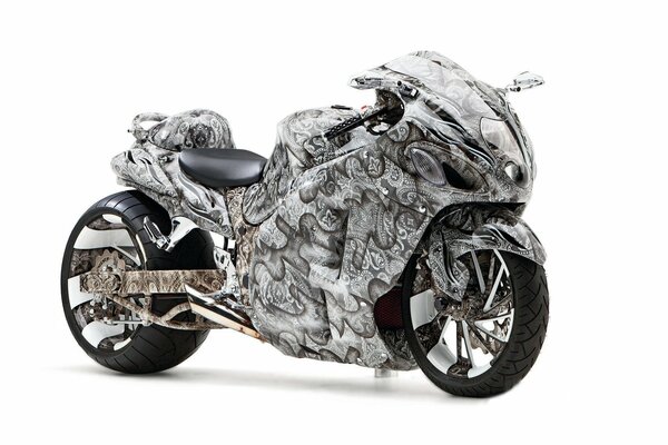 There is a sports bike with beautiful patterns and disks