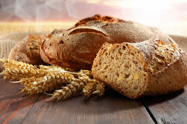 Freshly baked grain bread on a wooden table